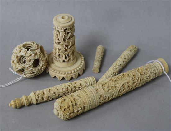 A 19th century Canton carved ivory bodkin case, L 15.5cm, a concentric puzzle ball on stand and four other carved ivory items